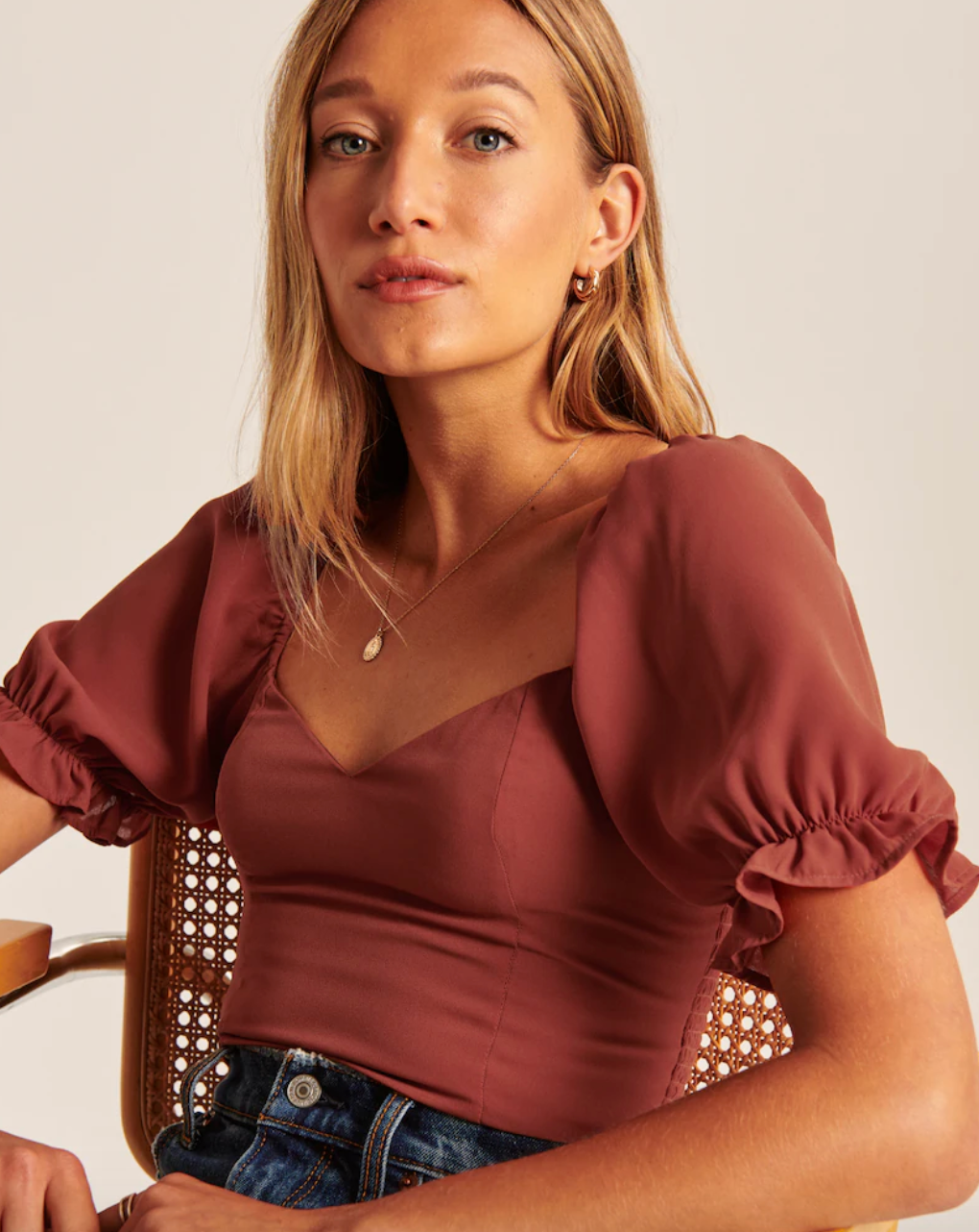 model wearing pink top 