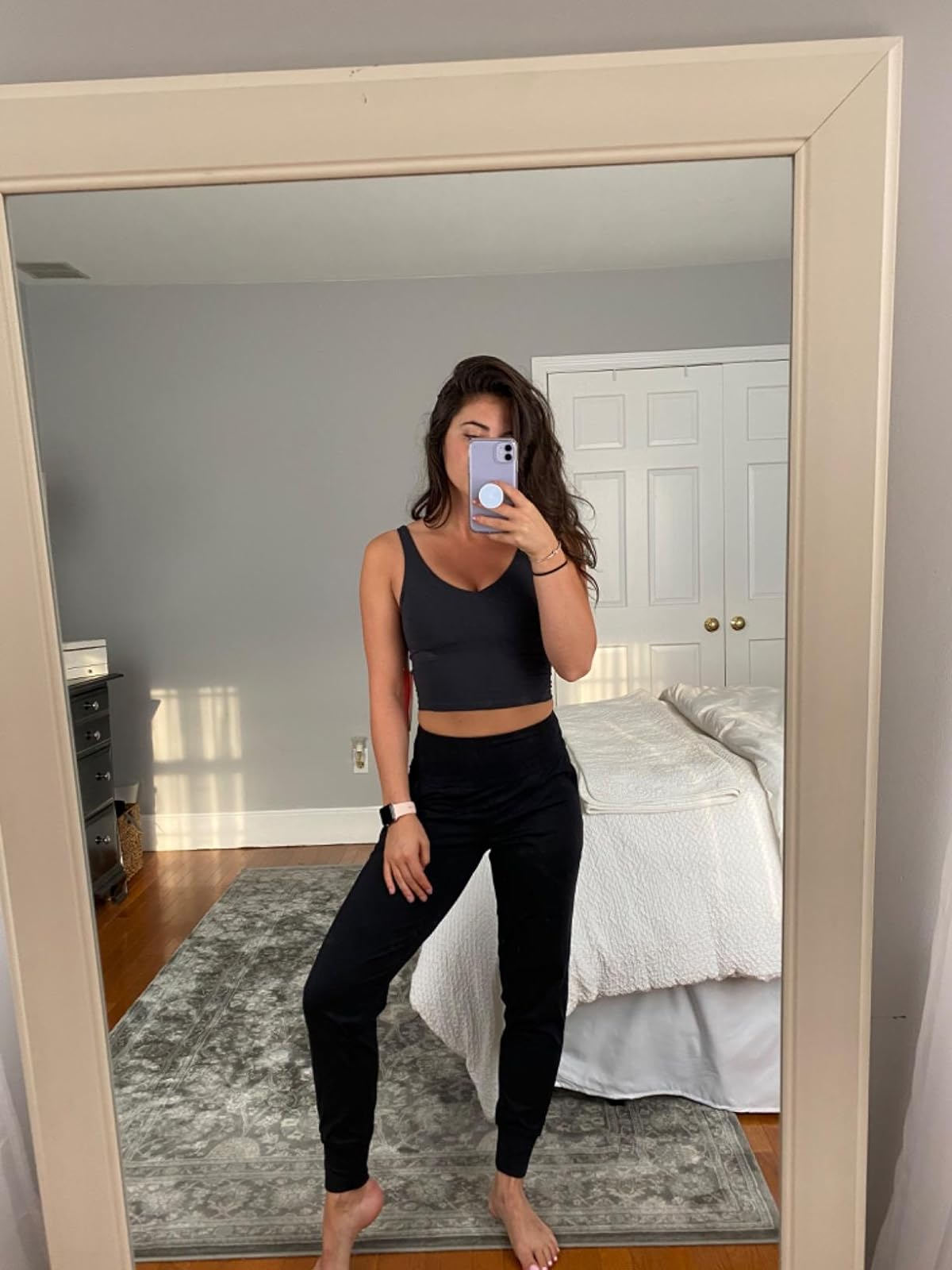Reviewer in black high waisted leggings with cuffed ankles 