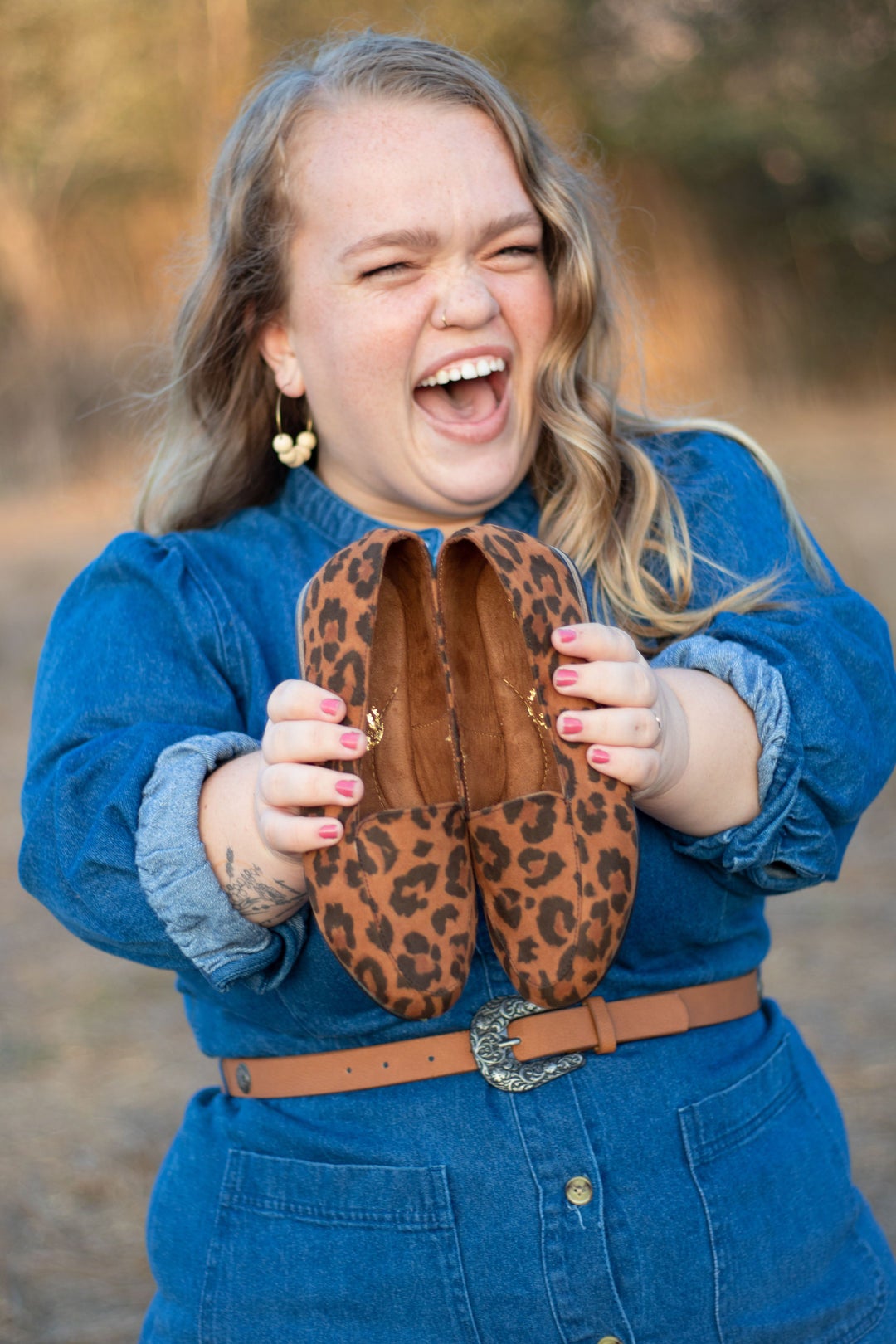 Model is holding the cheetah print