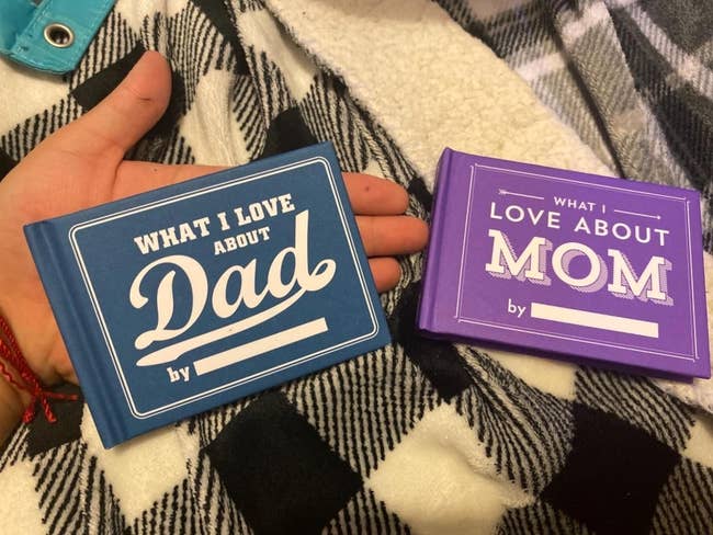 reviewer holding palm-size what I love about Dad and what I love about Mom books