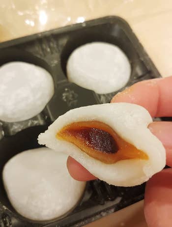 Mochi cut open to show the boba flavor on the inside 
