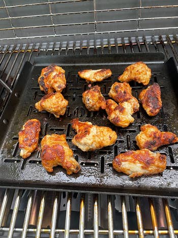 reviewer photo of chicken wings on the grill