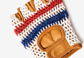 closeup of red, white, blue crochet bike glove