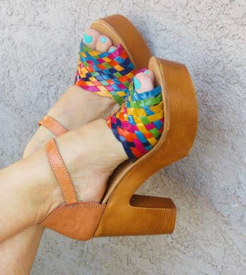 model's feet wearing the colorful wedges