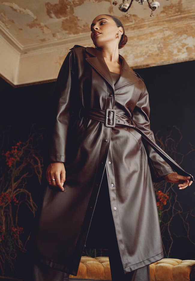 model in brown faux leather long jacket