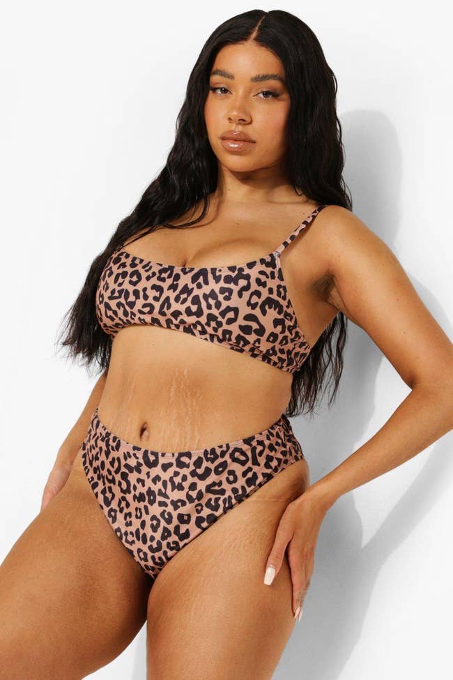 Model in the leopard print suit with scoop top and mid-rise bottoms