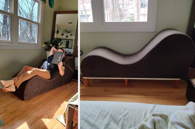 Reviewer laying on brown curved lounge chair reading a book, side view of curved lounger on top of a wooden elevated stand