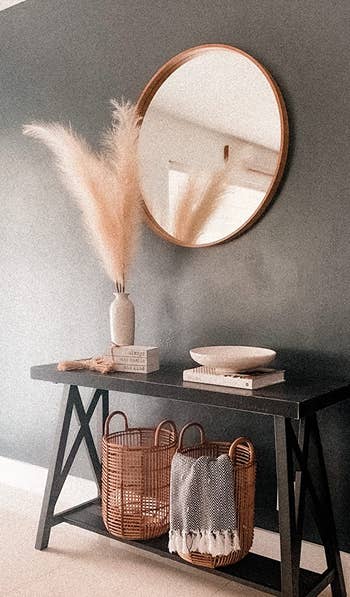 reviewer's pampas grass styled in a vase next to a mirror