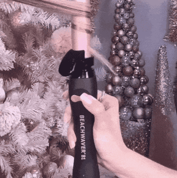 gif of model curling another models hair