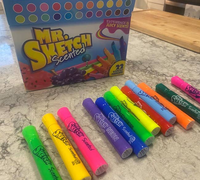 Mr. Sketch Scented Marker set with box and various markers displayed on a table