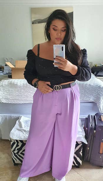 Reviewer wearing lilac pants