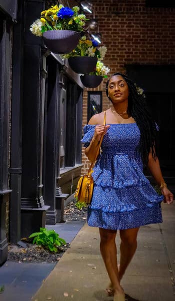 reviewer in blue mini tiered ruffle dress