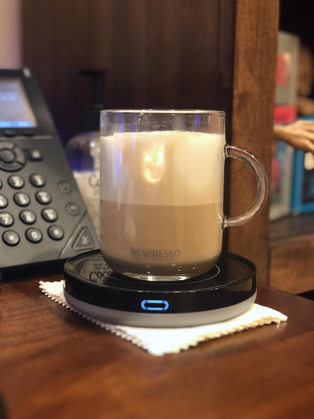 reviewer photo of Nespresso glass coffee mug on black mug warmer