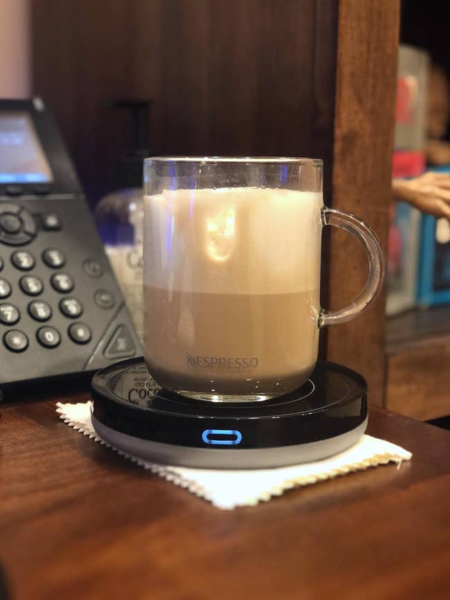 reviewer photo of Nespresso glass coffee mug on black mug warmer
