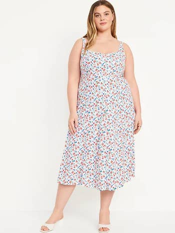 models in a floral midi sundress with thin straps and a scoop neckline
