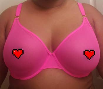 Reviewer wearing a pink mesh bra