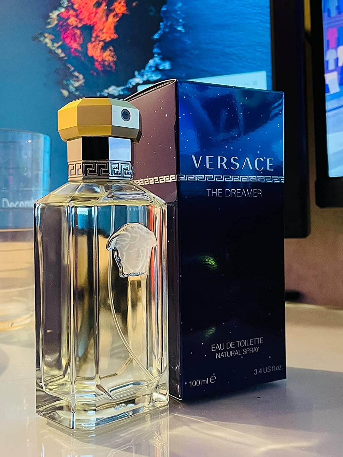 reviewers Versace cologne next to the box
