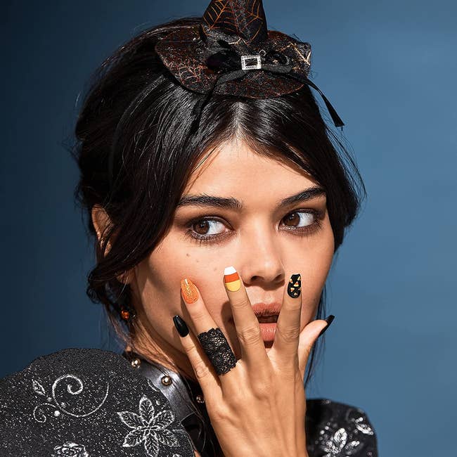 model wearing Halloween theme nails 