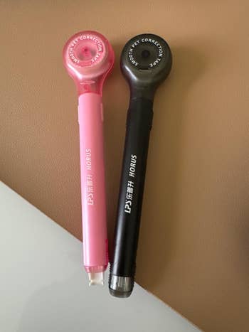 Two correction pens labeled 