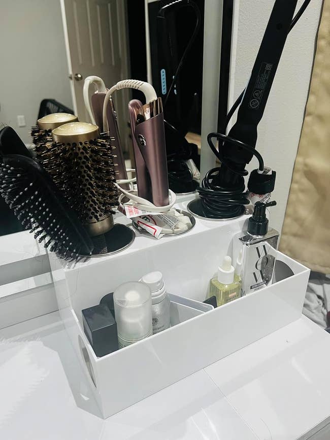 reviewers cosmetic organizer with hair styling tools and products