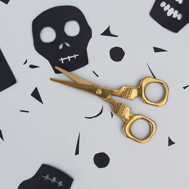 gold scissors that look like a skull 