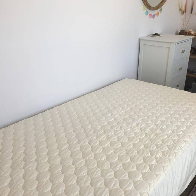 reviewer's furniture with the mattress pad connected it