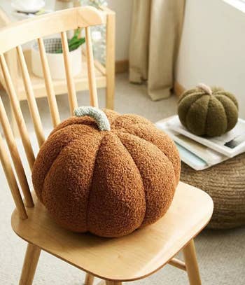 a close up image of the brown pumpkin pillow showing the texture