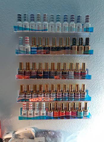 Reviewer image of same shelves holding nail polish bottles 