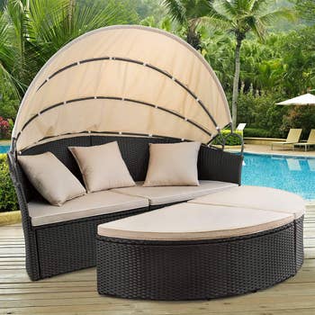 the outdoor daybed next to pool