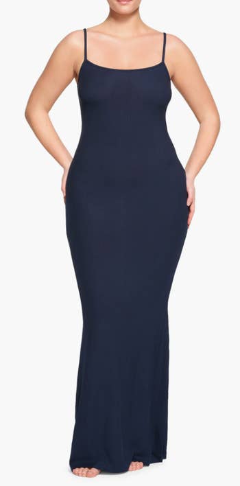 model wearing navy blue dress