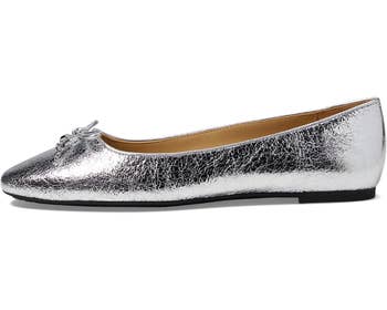 Shiny metallic ballet level with a tiny bow connected the toe, displayed successful a broadside view. Perfect for stylish and comfy wear