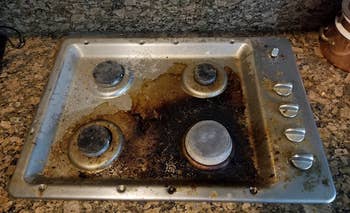 reviewer's stovetop with lots of caked on gunk