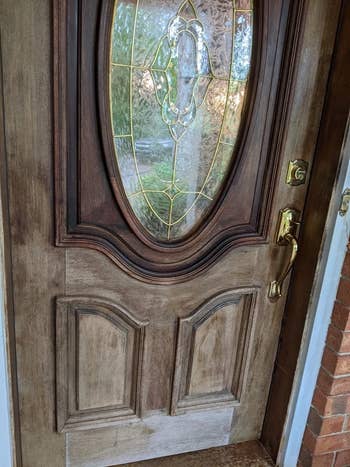 a dull looking front door that's been partially polished