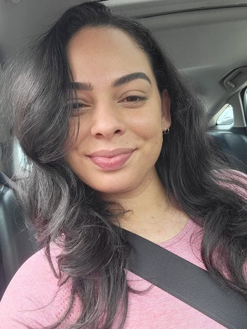 a reviewer with blown out hair after using the revlon brush