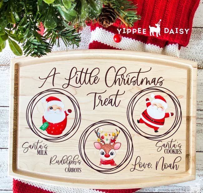 large wood tray with images and text indicating a place for Santa's milk/cookies and Rudolph's carrots