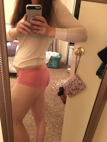 image of a reviewer wearing the lace-back pantie in pink