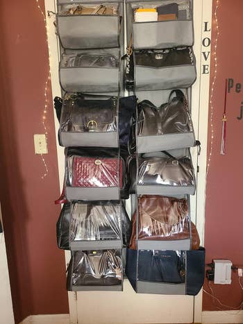 outside of reviewer's closet door with two grey organizers hanging over it holding multiple purses