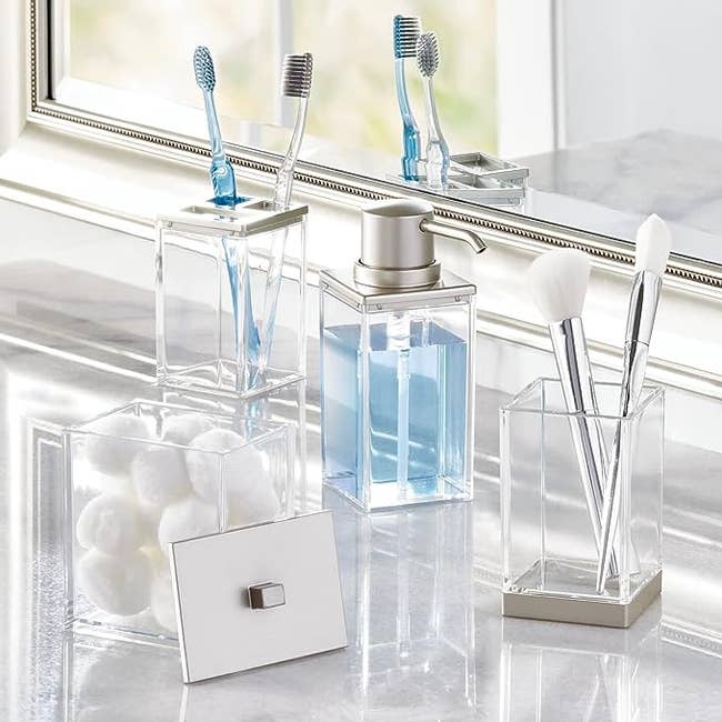 A set of clear bathroom container accessories