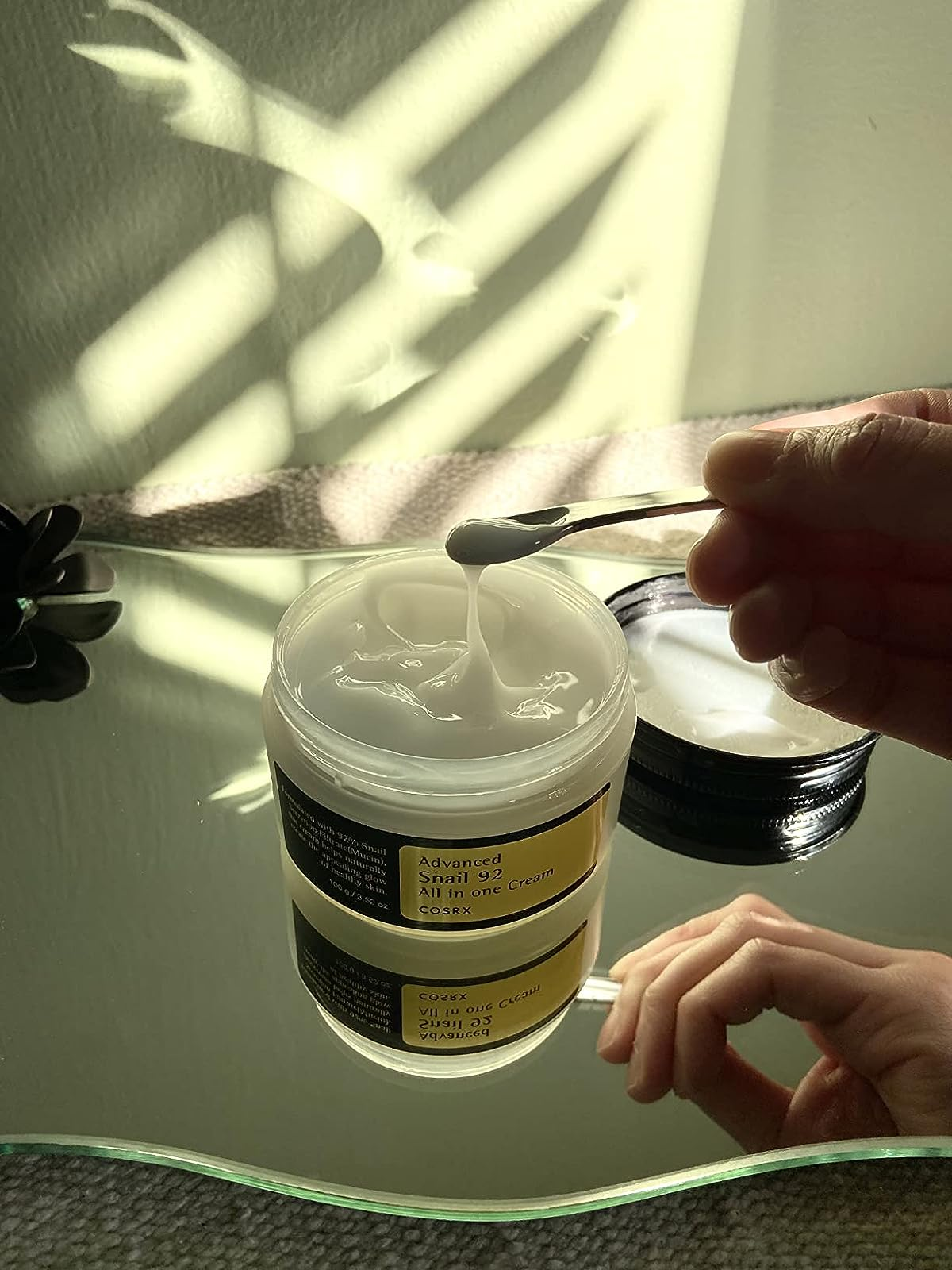 a jar of snail mucin moisturizer