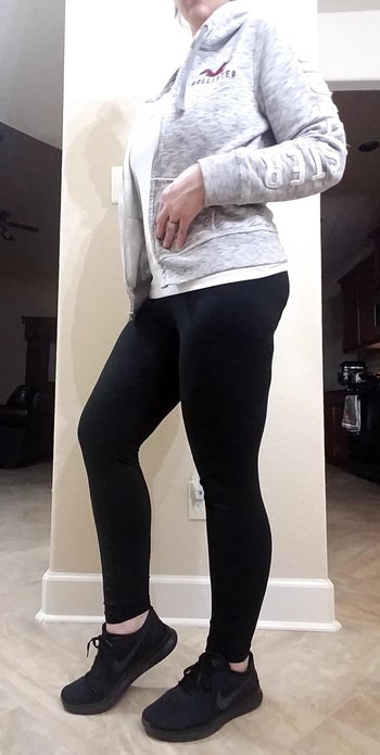 a reviewer wearing the full length legging in black