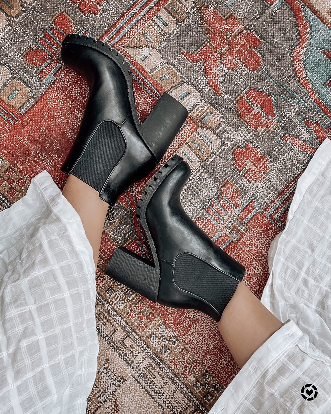 overhead changeable  of reviewer's feet wearing the achromatic  boots