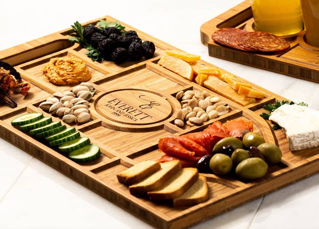 an assortment of nuts and cheese on a personalized charcuterie board
