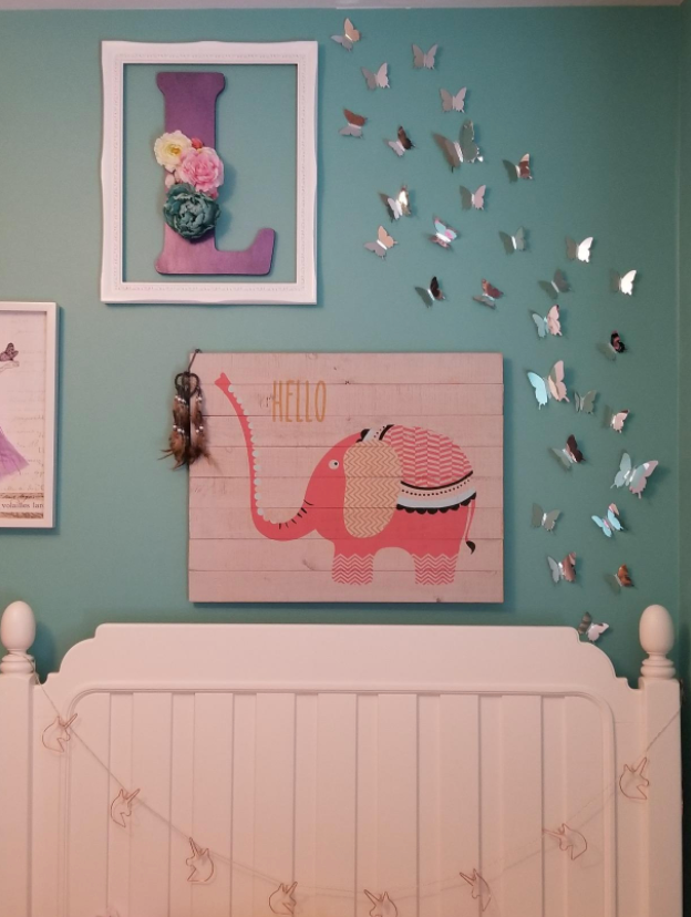 wall of kid's bedroom with mirrored 3D butterfly