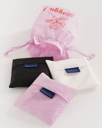 each of the bags folded up into corresponding carrying pouches 