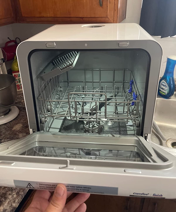 reviewer image of the inside of the countertop dishwasher