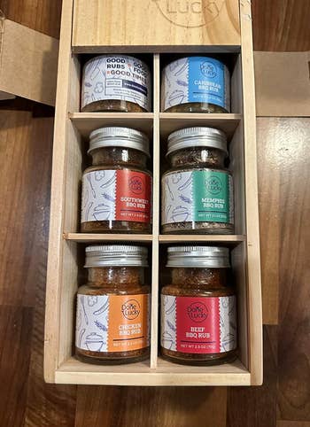Gift box with assorted BBQ spice rubs, including chicken and beef flavors, organized neatly