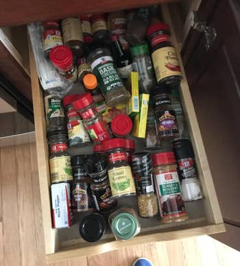 mess of spices in a drawer