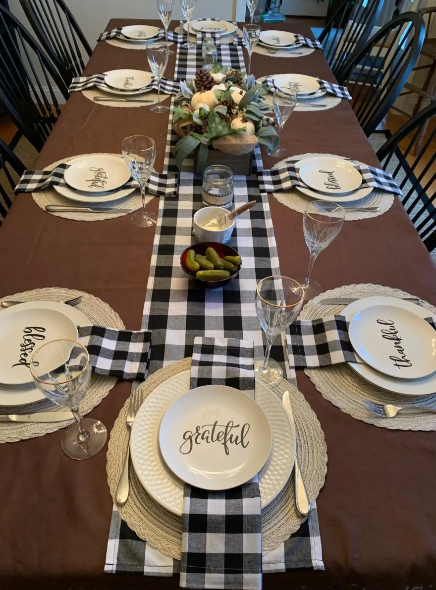 set of eight beige placemats on a reviewer's table