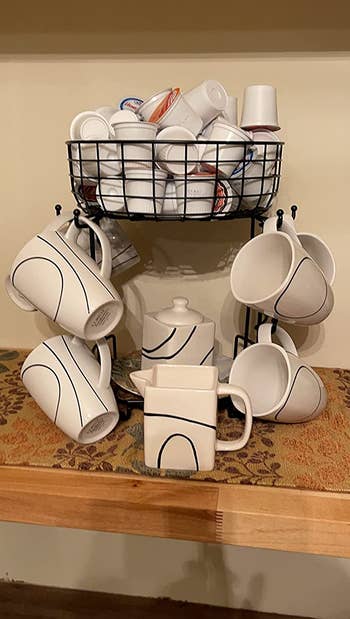 reviewer photo of mug holder with creamer in storage basket