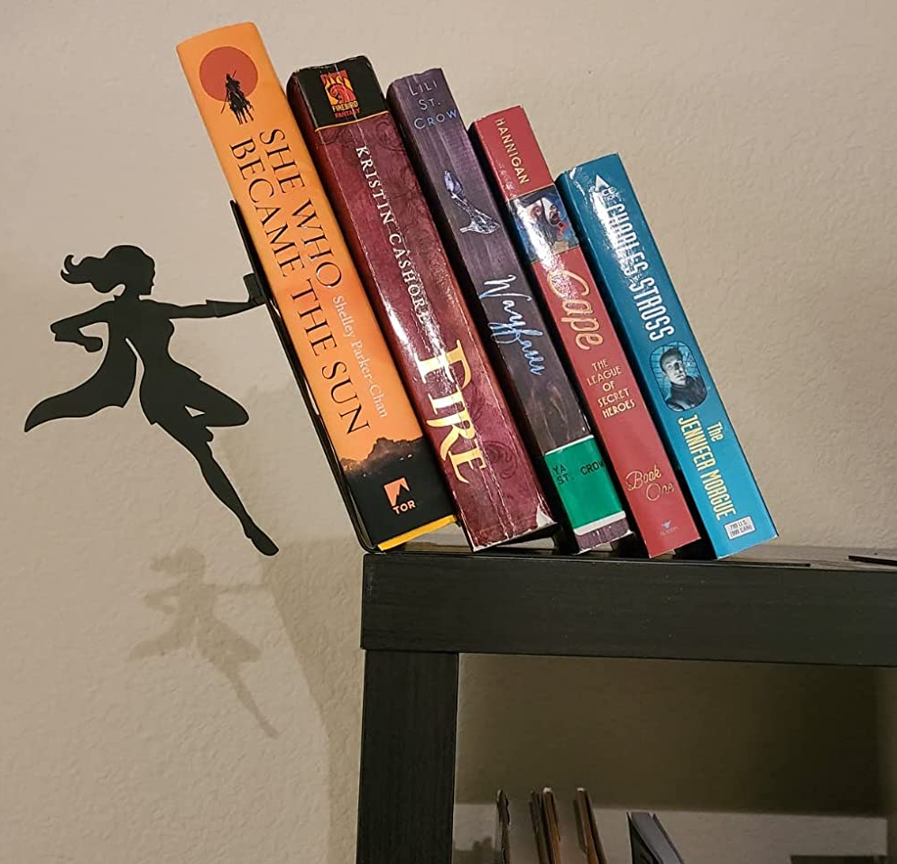 reviewer image of the bookend with a superhero holding up a stack of books